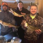 3 guys ice fishing walleye